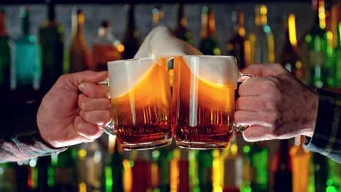Super slow motion of hitting beer mugs together, cheers concept Stock Footage 233254698