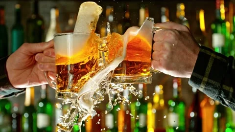 Super slow motion of hitting beer mugs together crashing glass. Stock Footage 233255690