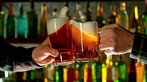 Super slow motion of hitting beer mugs together, cheers concept Stock Footage 233256055