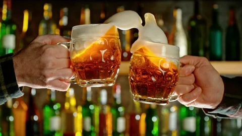 Super slow motion of hitting beer mugs together, cheers concept Stock Footage 233256190