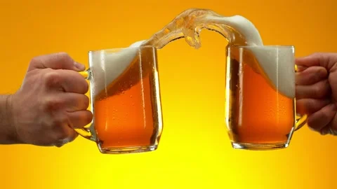 Super slow motion of hitting beer mugs together, cheers concept Stock Footage 237164008