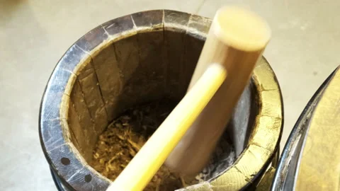 Super slow motion of hitting mortar pestle on pepper seeds. Stock Footage 234591178