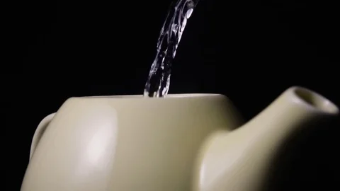 Super slow motion hot water is poured into the teapot Stock-Footage 72862680
