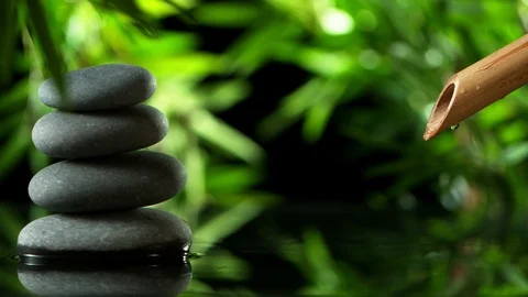 Super slow motion of leaking water stream from bamboo, spa and wellness concept. Stock Footage 124394918
