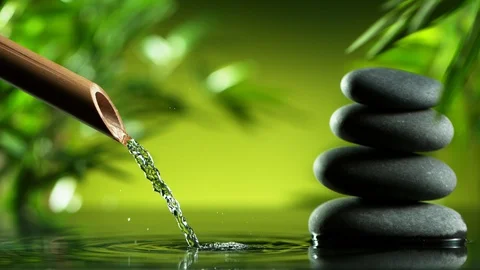 Super slow motion of leaking water stream from bamboo, spa and wellness concept. Stock Footage 124396387