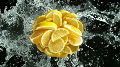 Super slow motion of lemon slices with water splash. Stock Footage 231986465