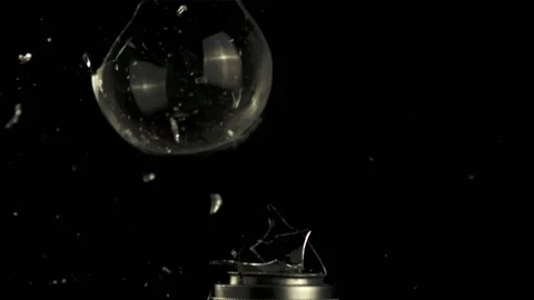 Super slow motion light bulb explodes with shards of glass. Stock Footage 162954003