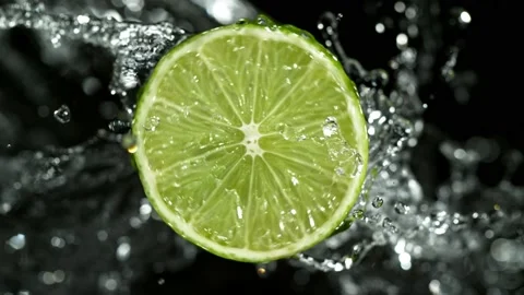 Super Slow Motion of Lime Slice With Water Splashes. Stock Footage 201028581