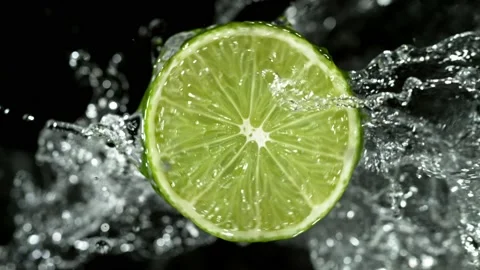 Super Slow Motion of Lime Slice With Water Splashes. Stock Footage 201028602