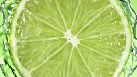 Super Slow Motion of Lime Slice With Water Splashes. Stock Footage 216648519