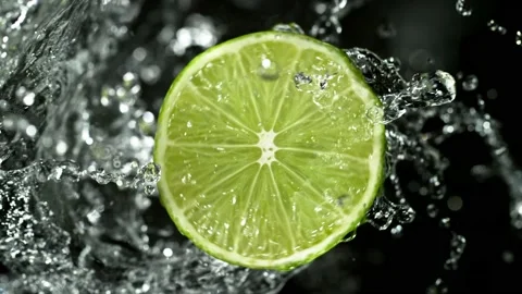 Super Slow Motion of Lime Slice With Water Splashes. Stock Footage 216655788