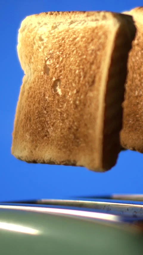 Super slow motion Lively animation showcasing golden toasted bread lifting with 動画素材 326276899