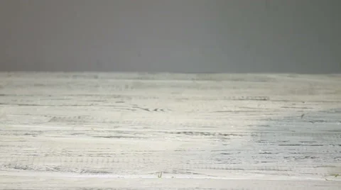 Super slow motion macro of falling dill  pieces on a wooden kitchen table Stock Footage 59994187