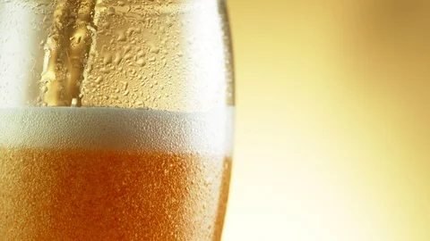 Super slow motion of macro shot of pouring beer drink, close-up. Stock Footage 125284716