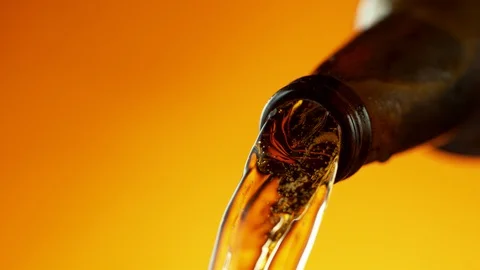 Super slow motion of macro shot of pouring beer drink, close-up. Stock Footage