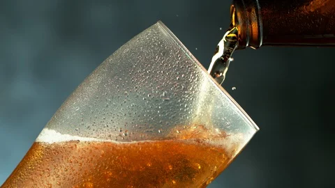 Super slow motion of macro shot of pouring beer drink, close-up. Stock Footage 129410420