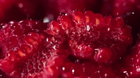 Super Slow Motion Macro Shot of Water Droplets Falling on Fresh Raspberries at 136780431