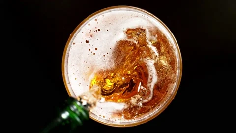 Super slow motion of macro shot of pouring beer drink, top view. Stock Footage 165014200