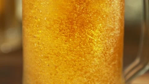 Super slow motion of macro shot of beer drink bubbling, close-up. Stock Footage 229697890
