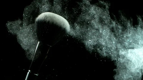 Super slow motion of makeup brush with falling powder, black background Stock Footage 118373975