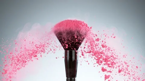 Super slow motion of makeup brush with exploding pink powder. Stock Footage 162336268