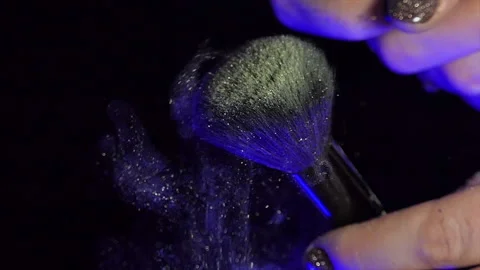 Super slow motion makeup brush with exploding powder. Shot on a high-speed film Stock Footage 227934560