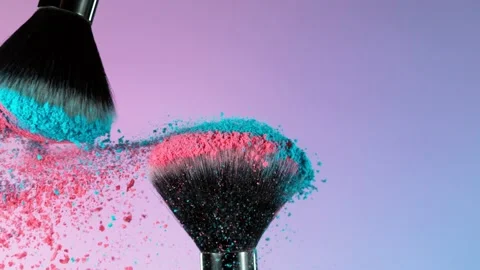 Super slow motion of makeup brushes with flying colored powder. Stock Footage 210775513