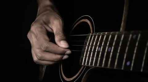 Super slow motion man playing guitar in dark tone Stock Footage 67166093