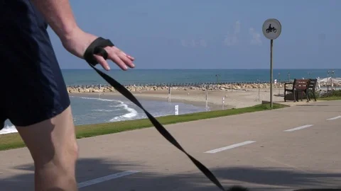 Super slow motion of a man walking his dog Stock Footage 75933799