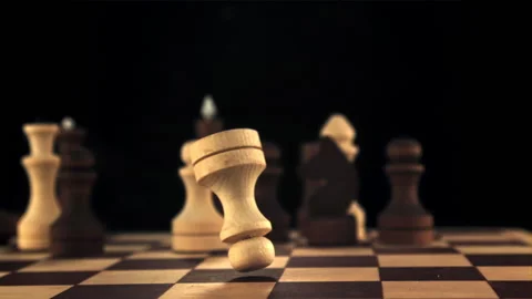 Super Slow Motion Chess Pieces Fall on the Chessboard. Filmed on a