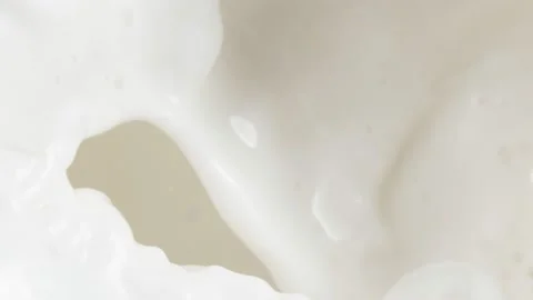 Super slow motion of milk liquid splashing, close-up. Stock Footage 151769915