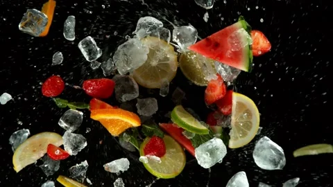 Super slow motion of mix fruit rotating in water, black background. Stock Footage 134488662