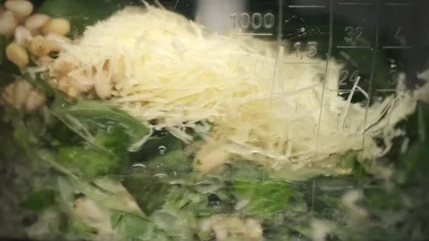 Super slow motion of mixing ingredients for pesto sauce in a blender Stock Footage 202043282