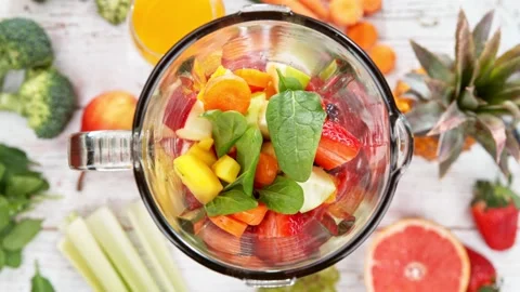 Super slow motion of mixing pieces of fruits in blender. Stock Footage 170163380