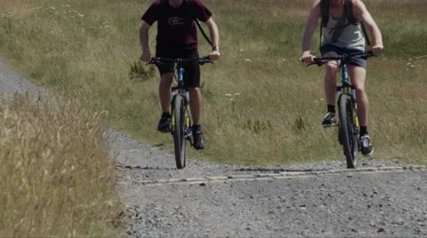 Super Slow Motion Mountain Biking Uphill - High Frame Rate Stock Footage 52030837