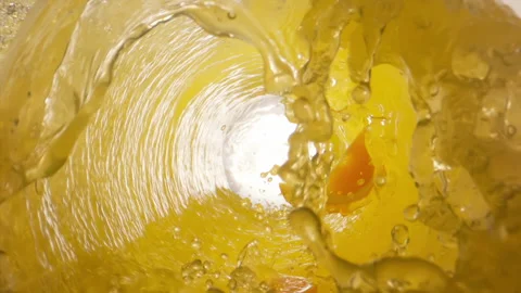 Super Slow Motion Orange juice  Vortex at 1000 fps Stock Footage 253471259