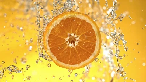 Super Slow Motion of Orange Slice With Water Splashes. Stock Footage 204898598