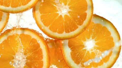 Super slow motion of orange slices with water splash Stock Footage 107519489