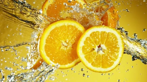 Super slow motion of orange slices collision with water splashes Stock Footage 133072101