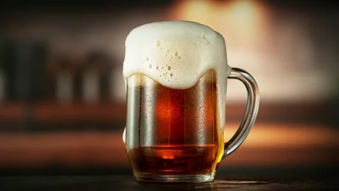 Super Slow Motion of Overflowing Foam from Beer Pint. Stock Footage 287437818