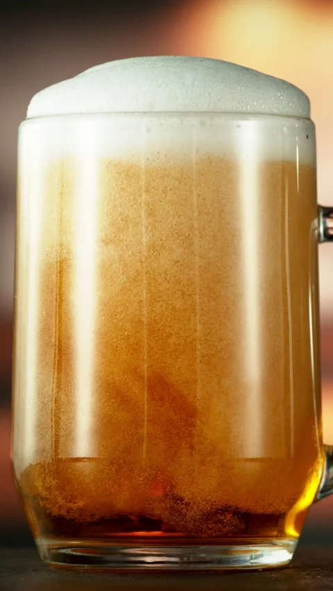 Super Slow Motion of Overflowing Foam from Beer Pint. Stock Footage 289315407