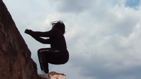 Super slow motion parkour guy makes backflip inside warehouse Stock Footage 117683925