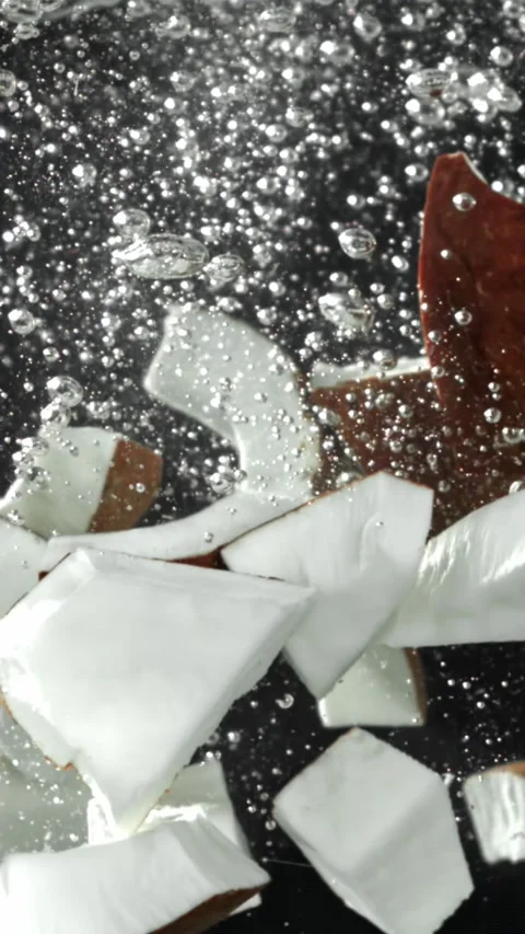 Super slow motion pieces of fresh coconut . Filmed on a high-speed camera at 動画素材 335381753