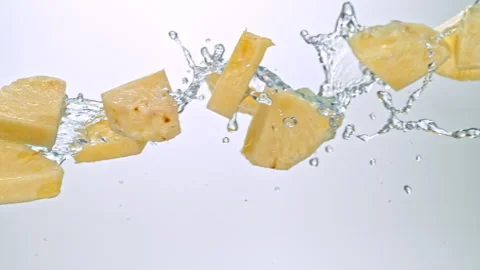 Super Slow Motion of Pineapple Slices Flying with Splashing Water at 1000fps on Stock Footage 304437117