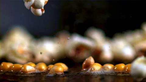 The super slow motion of the popcorn grain explodes with bubbles of oil. Filmed Stock Footage 271236558