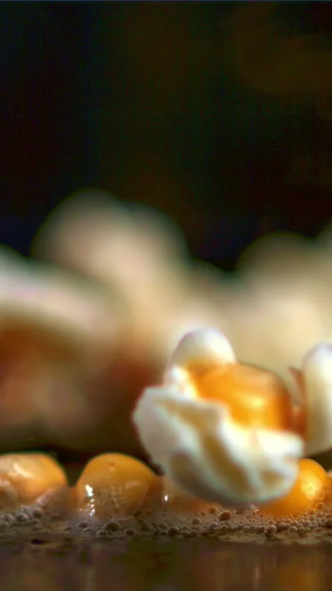 Super slow motion popcorn grains explode. Filmed on a high-speed camera at 1000 Video stock 335288724