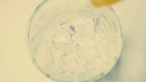 Super slow motion pour orange juice Stock Footage 72215947