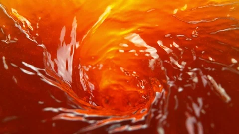 Super slow motion of pouring apple juice or ice tea drink in twister shape Stock Footage 124262461