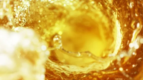 Super slow motion of pouring beer or spirit drink in twister shape Stock Footage 108797031