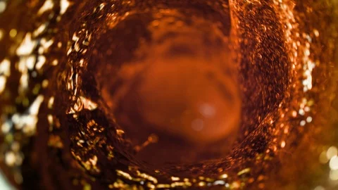 Super slow motion of pouring beer or spirit drink in twister shape. Stock Footage 117249976